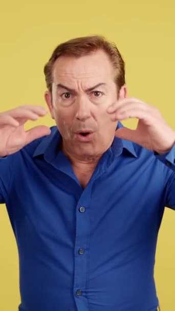 Surprised Mature Man Gesturing Make Mistake Studio Yellow Background — Video