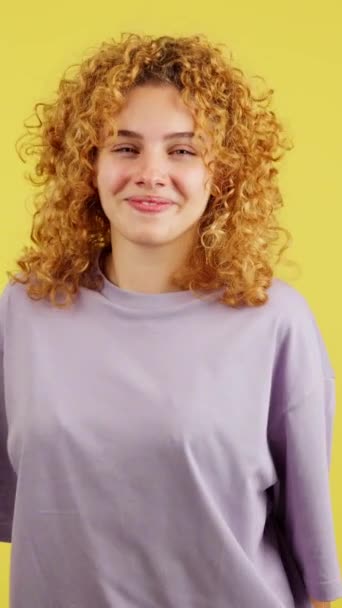 Studio Video Yellow Background Happy Young Woman Smiling Camera While — Stockvideo