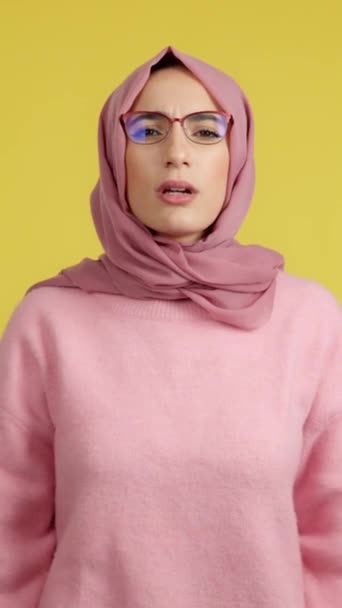 Muslim Woman Taking Her Glasses See Studio Yellow Background — Vídeos de Stock