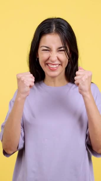 Happy Hispanic Woman Celebrating While Raising Arms Studio Yellow Background — ストック動画