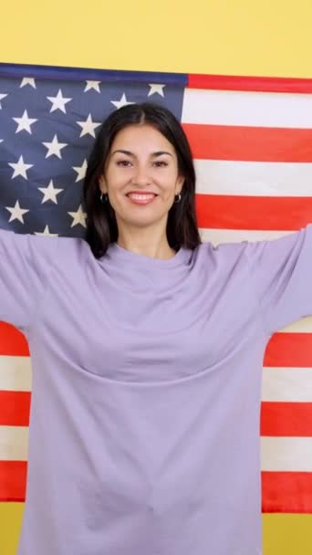 Happy Caucasian Woman Raising Usa National Flag Studio Yellow Background — Stockvideo