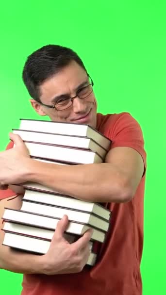Merry Man Red Shirt Glasses Hugging Pile Good Books Looking — Stock Video