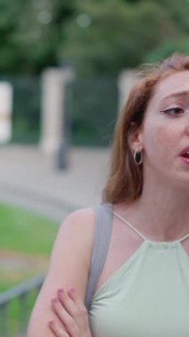 Two caucasian women having an discussion in the street