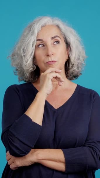 Studio Video Blue Background Aged Caucasian Woman Looking Expression Disgust — Stockvideo