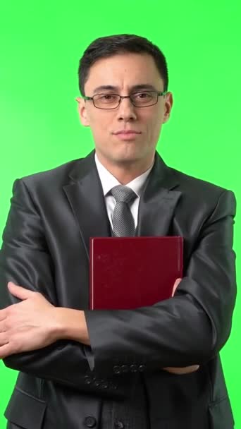 Positive Male Teacher Formal Suit Eyeglasses Holding Red Book Looking — Stock Video