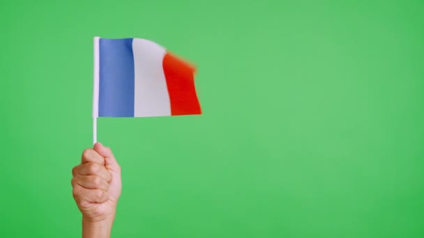 Viento Ondeando Banderín Francés Sostenido Por Una Mano — Vídeos de Stock
