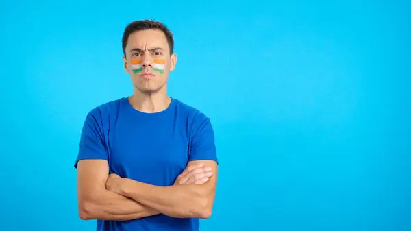 stock image Dignified and serious man with indian flag painted on face looking the camera with dignity