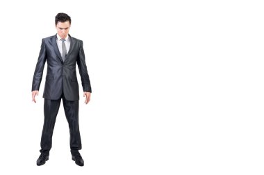 Full body of confident male in formal suit frowning and looking at camera isolated on white background in light studio clipart