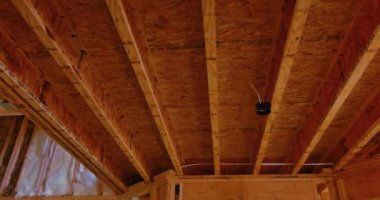 The wooden beams sticks that being used to build a new house are being installed