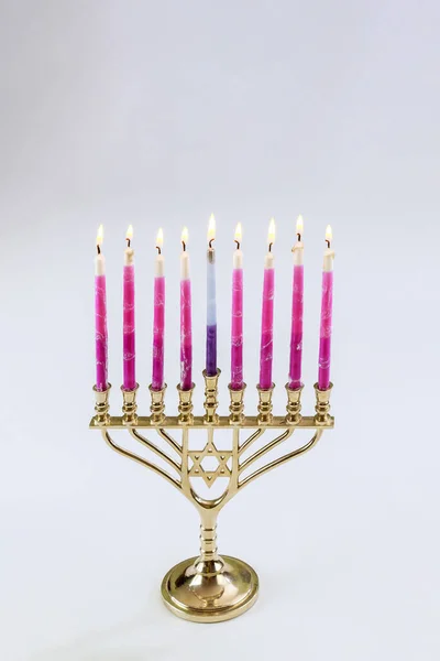 stock image Candles holiday symbols lit in Menorah Hanukkah festival symbols with white background copy space