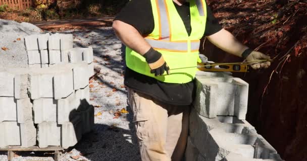 Contractor Constructing Block Retaining Wall Construction Site While Installing Newly — Stock Video