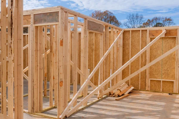 Timber frame house of wooden beam framework on stick built home under construction new build