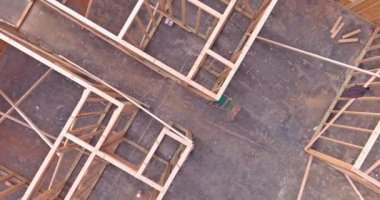 Wood framing beams stick framing building of new house under construction on built home