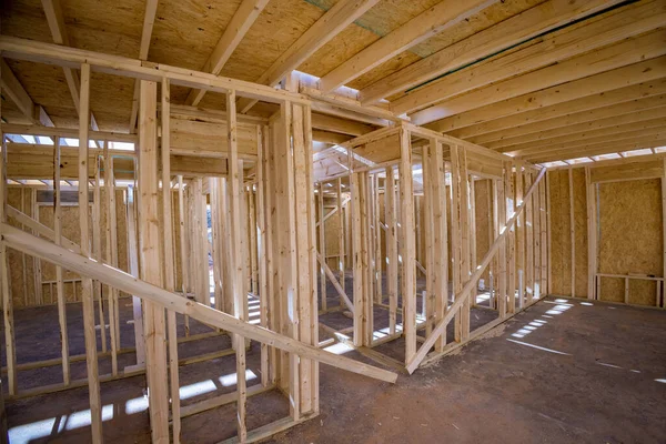 Wood framing beams stick framework of built interior new house under construction