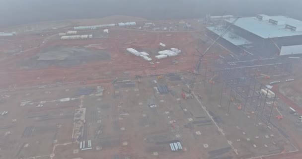 Construction Site Commercial Building Tower Cranes Work Dawn Heavy Fog — Video