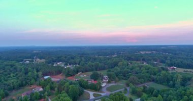 An American town village, located in state South Carolina, is surrounded by forest located on mountainous region area