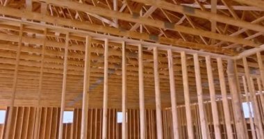 Newly house is under construction interior framing is already complete truss beams frame system are being installed