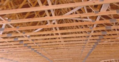 Interior framing of new house that is under construction framework truss beams frame system installed newly built home
