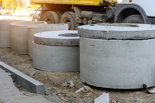 Concrete pipes to construct drainage systems on large cement drainage pipes for industrial building construction, selective focus.