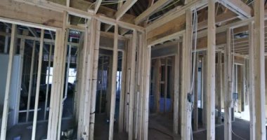 Before plasterboard can be installed on walls new building all communication lines and plumbing must be installed as part construction process.