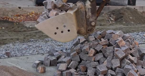 Excavator Pours Out Rocks Stones Laying Road Pavement — Vídeo de Stock