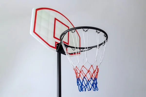 Isolated on white background is basketball basket hoop with rim and net