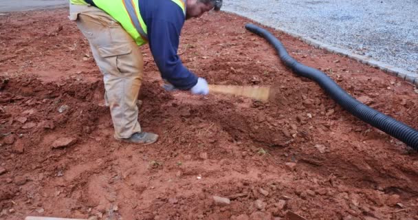 Heavy Rains Predicted Worker Digs Trench Drainage Pipes Can Laid — Vídeo de stock