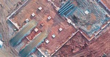 There are earthworks being carried out on construction site with use of bulldozer to prepare land for development