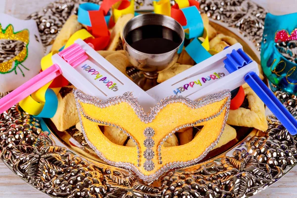 Purim festival is Jewish holiday that is celebrated with cookies, shofars, tallits, carnival masks, and hamantaschens