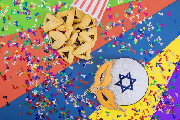 Purim festival is Jewish religious festival celebrated with cookies shofar noisemaker tallite carnival masks and hamantaschens as symbols of celebration