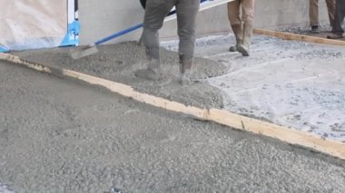 During construction of new house concrete mixing truck was used to pour concrete for pavement around home