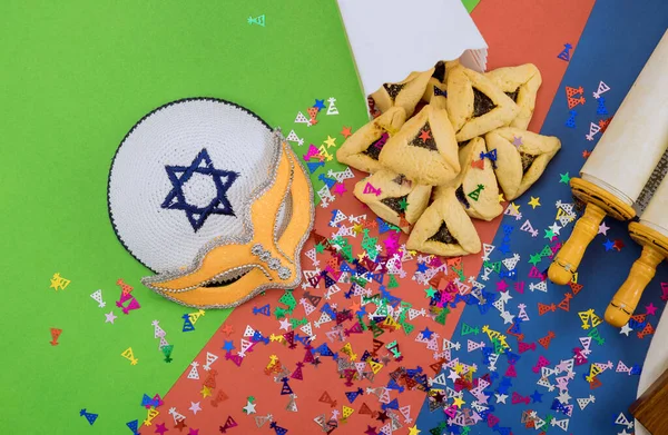Festival of Purim Jewish holiday religious with cookies, shofar tallits, hamantaschen celebration symbols carnival masks