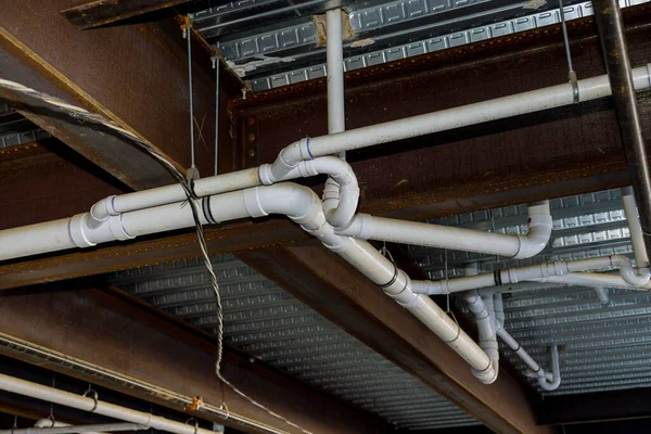 An apartment building complex has been installed with assembled waste pipe line system under ceiling