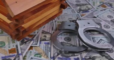 Judge using gavel signaled end of trial and seizure property defendant sentence to pay