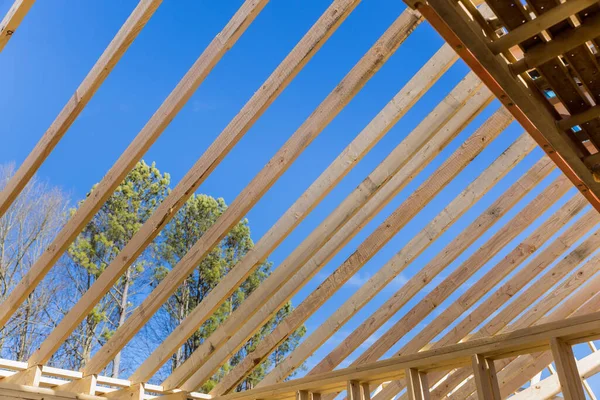 Wooden roof framework was constructed from trusses during construction of new beam stick home