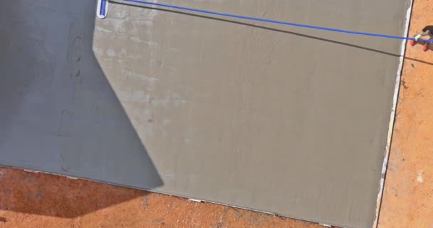 Pouring Concrete Wet Concrete Surface Worker Plasters Floor Trowel Using — Wideo stockowe