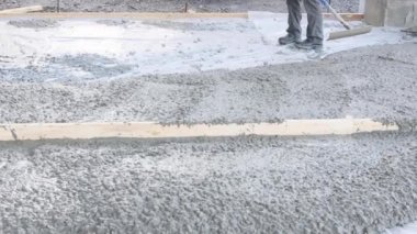 During construction of new house concrete mixing truck was used to pour concrete for pavement around home