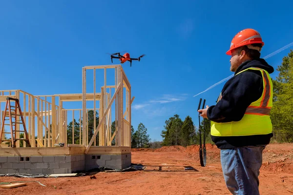 As construction inspector on site drone is used to check quality of construction work