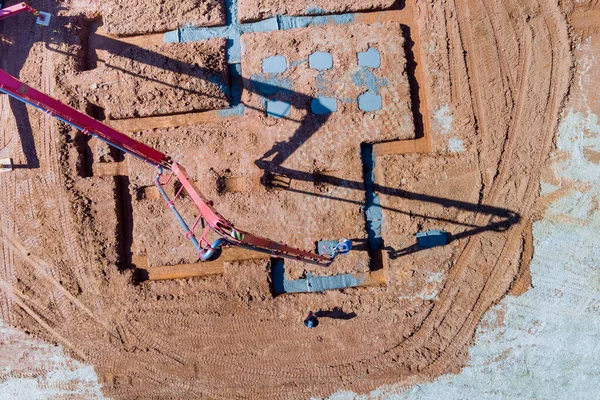 stock image Using concrete pump building construction worker pours concrete onto foundation of house