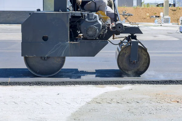 An asphalt paver machine steam roller will be used during construction of road during layering procedures for creating new road