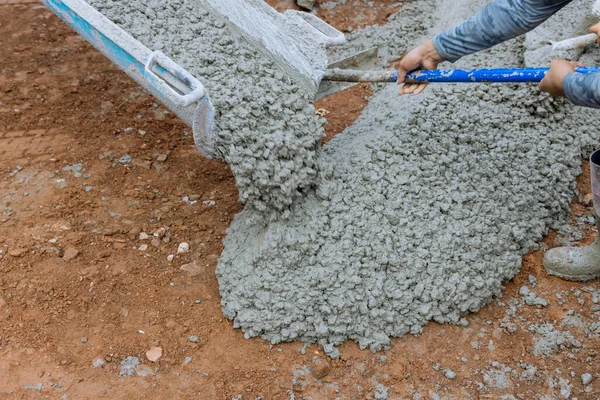 Concrete Mixing Truck Pours Concrete Building Site Surrounding Newly Constructed —  Fotos de Stock