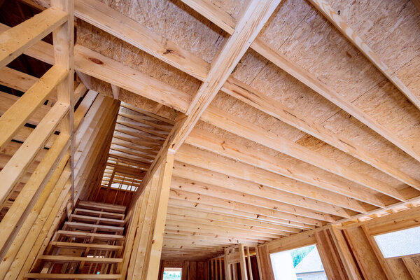 Wooden beams are used as inside frame support during construction of new house