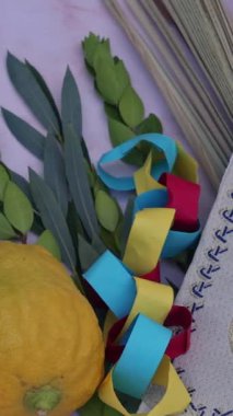 Sukkot, Jewish Orthodox festival Holidays is presence of traditional symbols such as Etrog, lulav, hadas, arava.