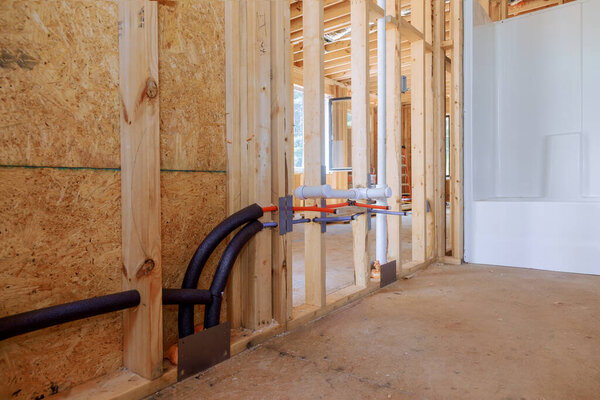 Rough plumbing with pvc waste water system in new home under construction
