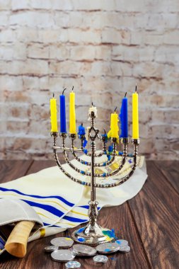 Jewish festival kindling hanukkah menorah candles on holy hanukkiah in Jew synagogue clipart