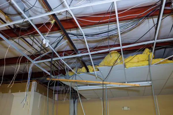 stock image Interior building reconstruction with in construction complex necessitates removal of old ceiling through ceiling works.