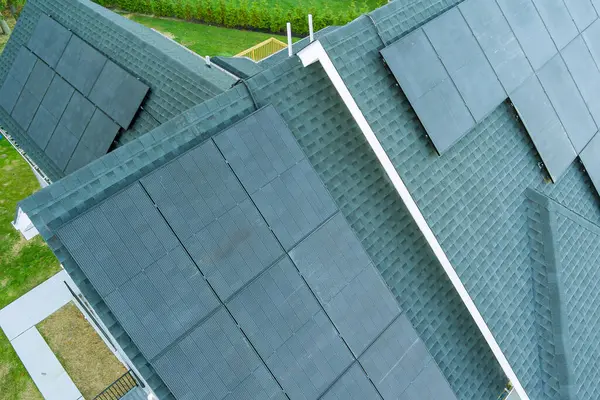 stock image Solar panel roof mounted on top a house is equipped with solar panels