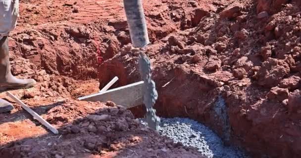 Construction Site Worker Pours Concrete Spreading Concrete Mix Foundation New — Stock Video