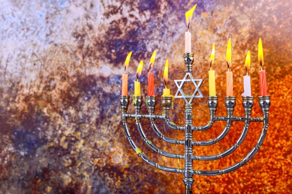 Traditional religion symbol of Jewish holiday Hanukkah with Hanukkiah menorah burning candles