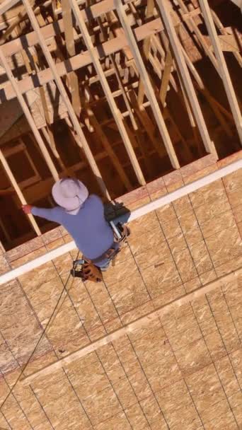 Building Construction Workers Hammer Nails Plywood Roof Top Future Home — Stock Video